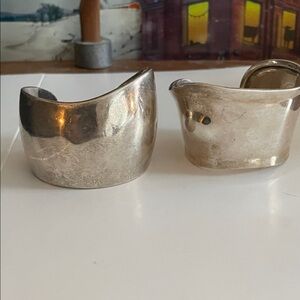 Silver Cuff Bracelets ($40 each) modern cuffs approx. 2” thick.